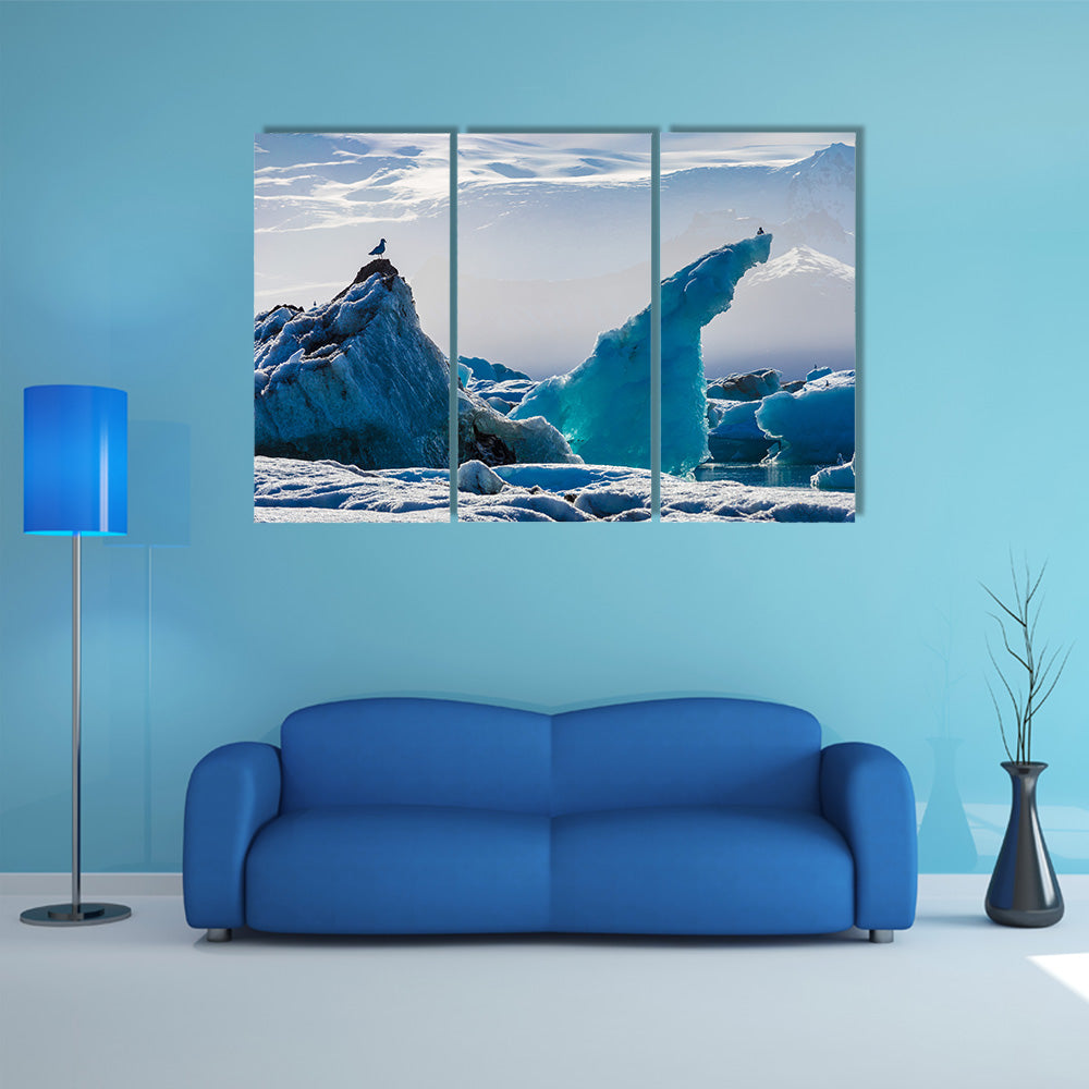 Seagulls above floating icebergs in Glacial Lagoon multi panel canvas wall art