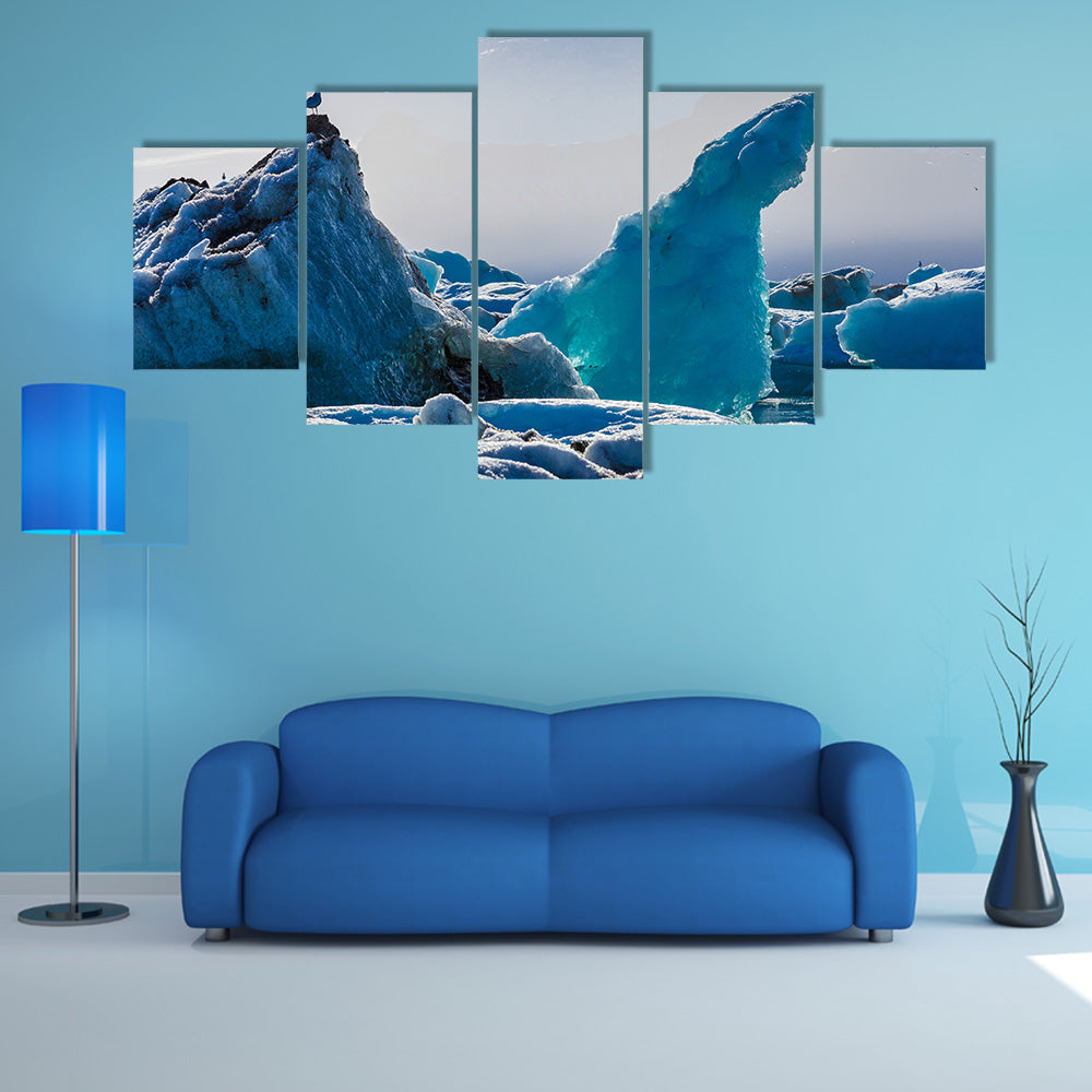 Seagulls above floating icebergs in Glacial Lagoon multi panel canvas wall art