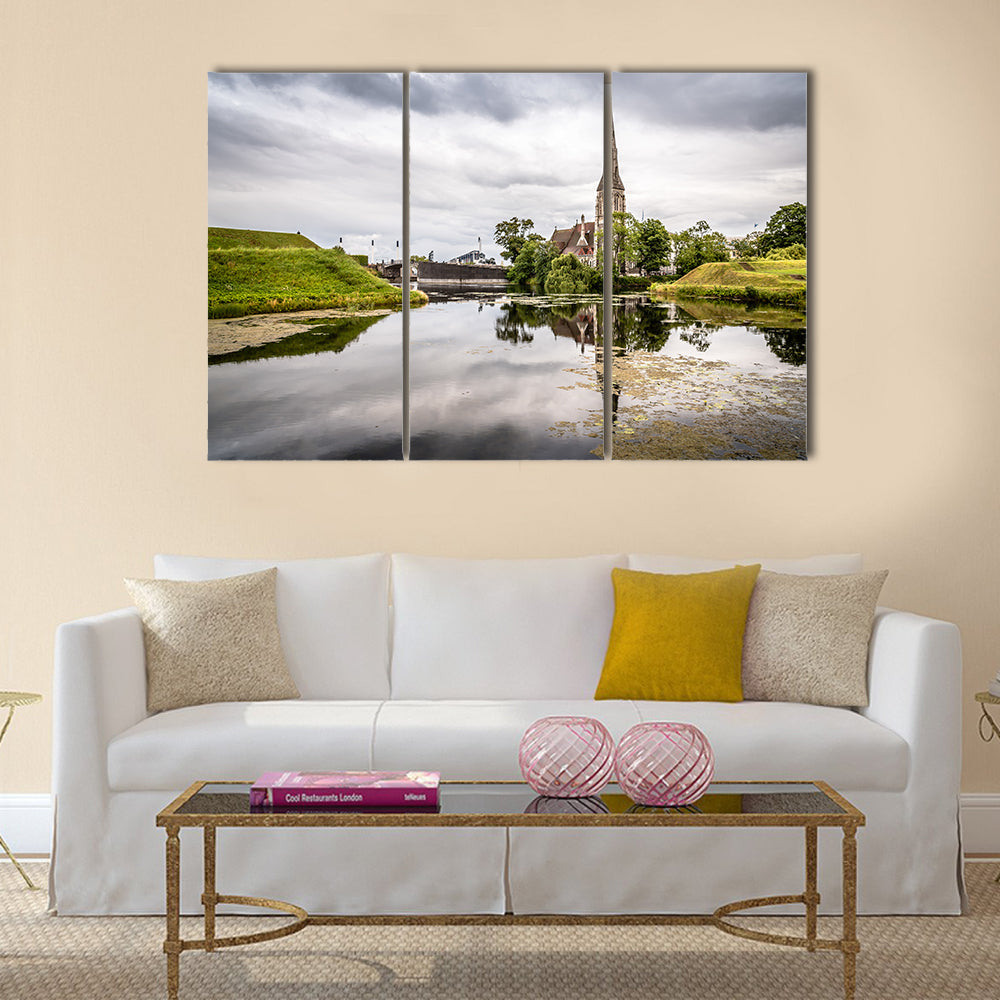 Church reflected on water pond in Churchill Park in Copenhagen a cloudy sunset Multi panel canvas wall art