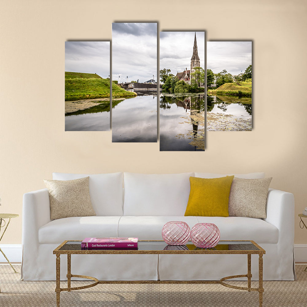 Church reflected on water pond in Churchill Park in Copenhagen a summer near sunset Multi Panel Canvas Wall Art