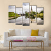 Church reflected on water pond in Churchill Park in Copenhagen a summer near sunset Multi Panel Canvas Wall Art