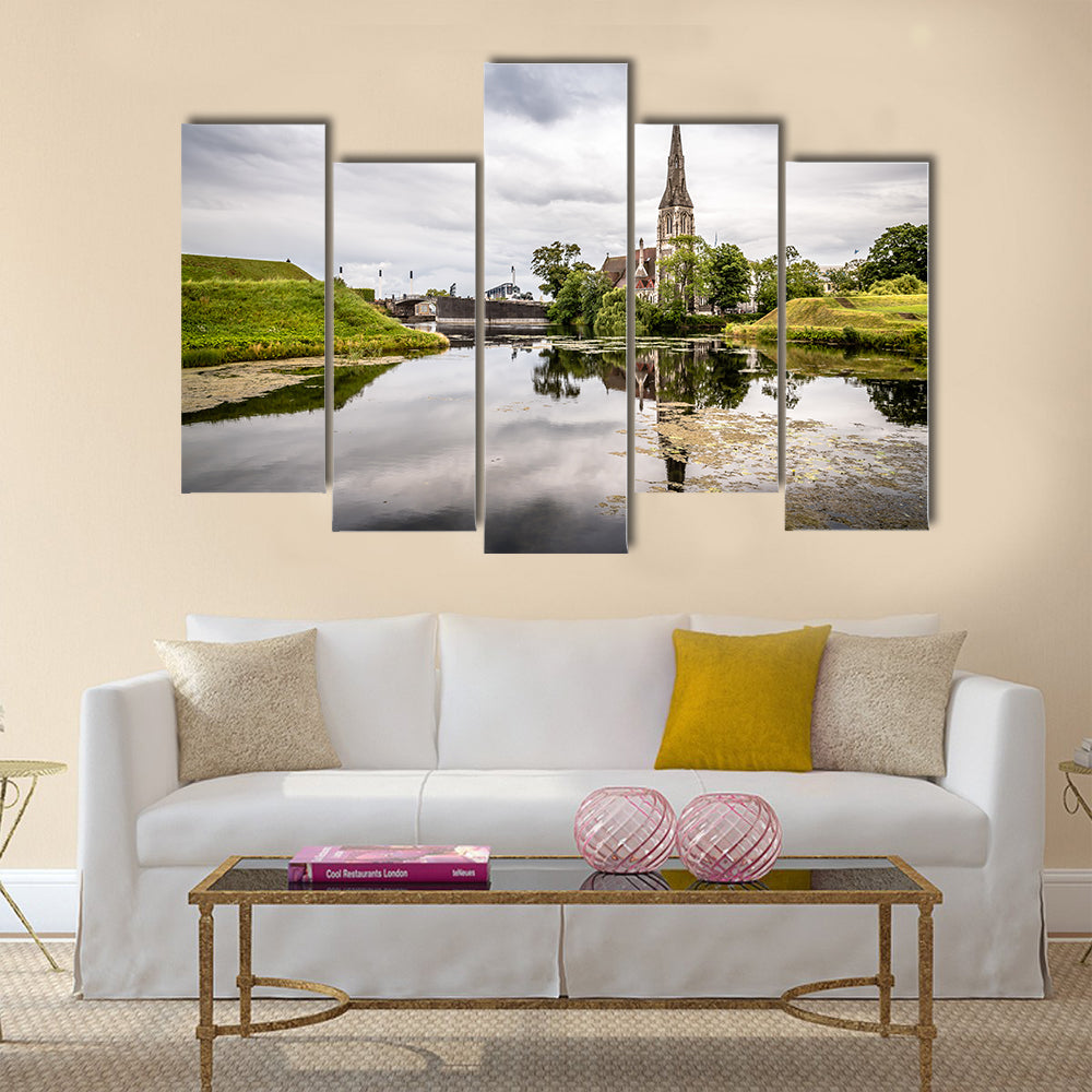 Church reflected on water pond in Churchill Park in Copenhagen a cloudy sunset Multi panel canvas wall art