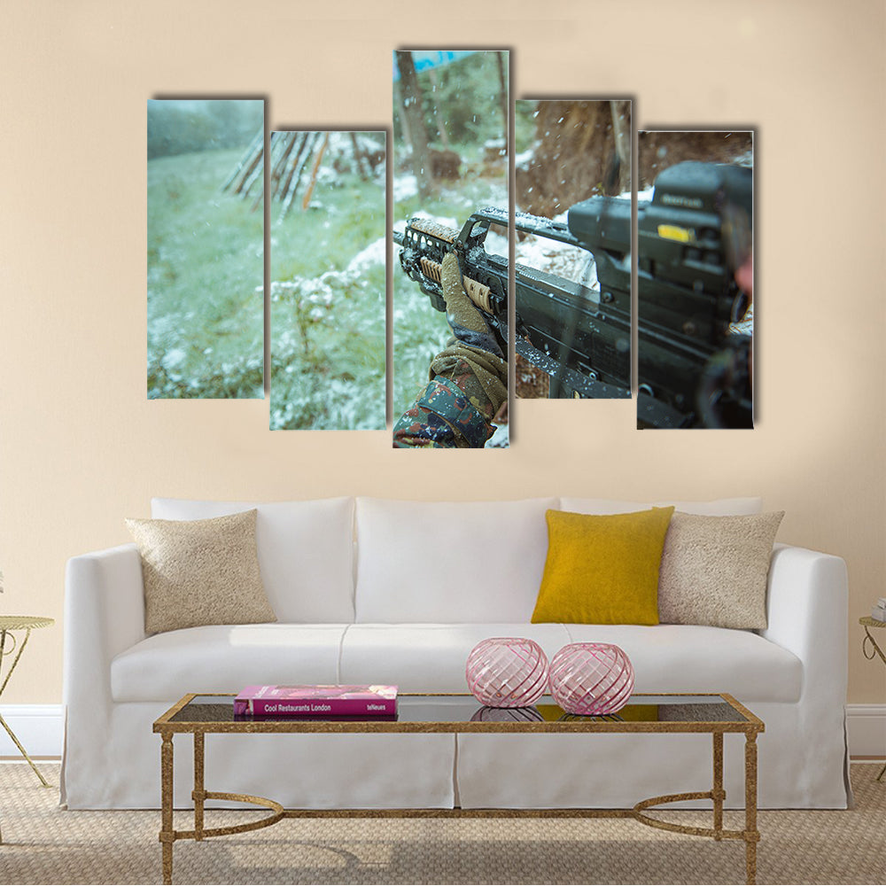 View Of A Sniper Having An Automatic Rifle In His Hand Multi Panel Canvas Wall Art