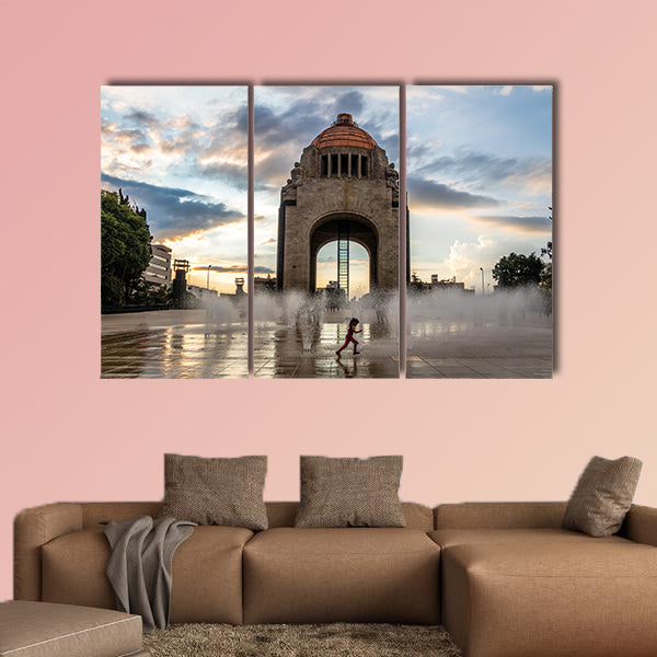 Girl playing with the water fountain in Mexico City multi panel canvas wall art