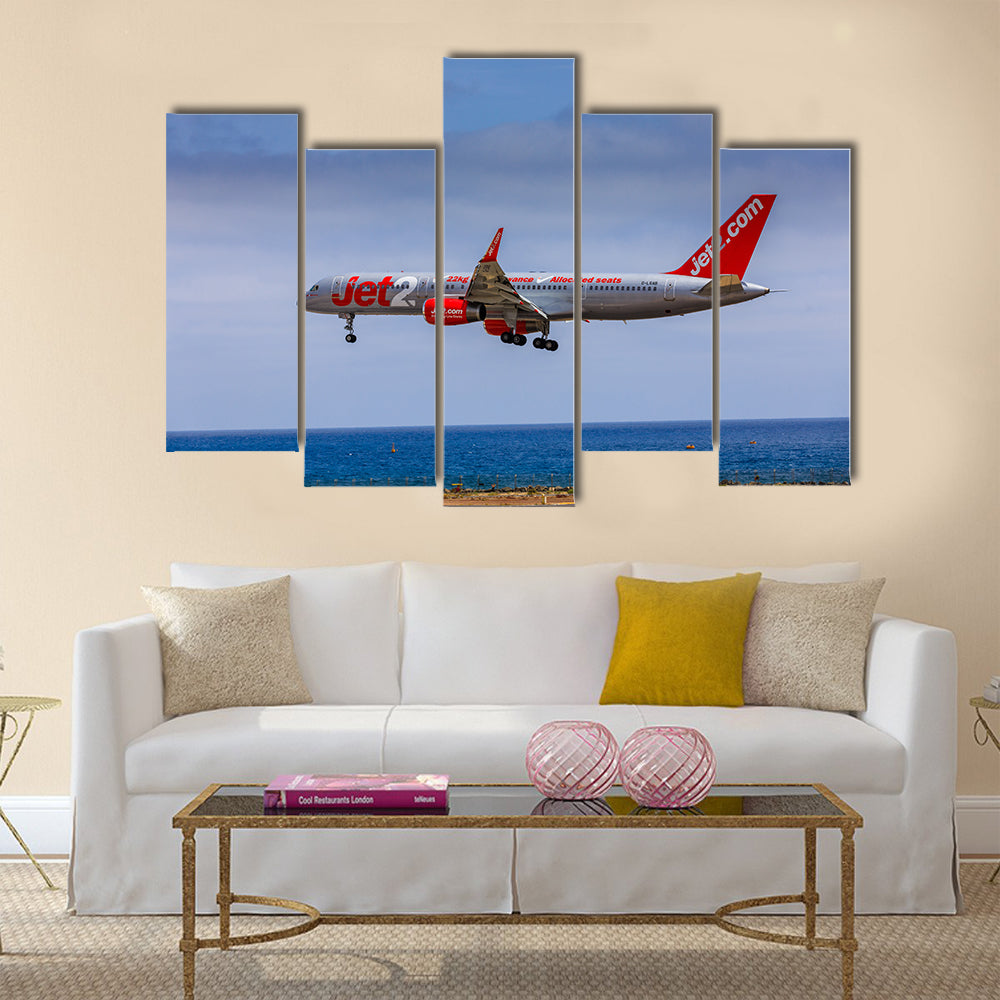 Boeing 757 - 200 of JET2 with the registration G-LSAB landing at Lanzarote Airport multi panel canvas wall art
