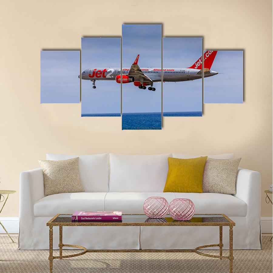Boeing 757 - 200 of JET2 with the registration G-LSAB landing at Lanzarote Airport multi panel canvas wall art
