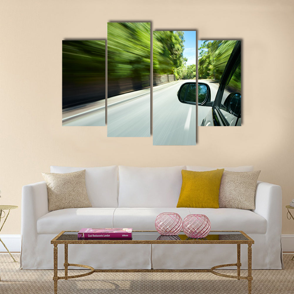 Car speeding on a straight road Multi panel canvas wall art