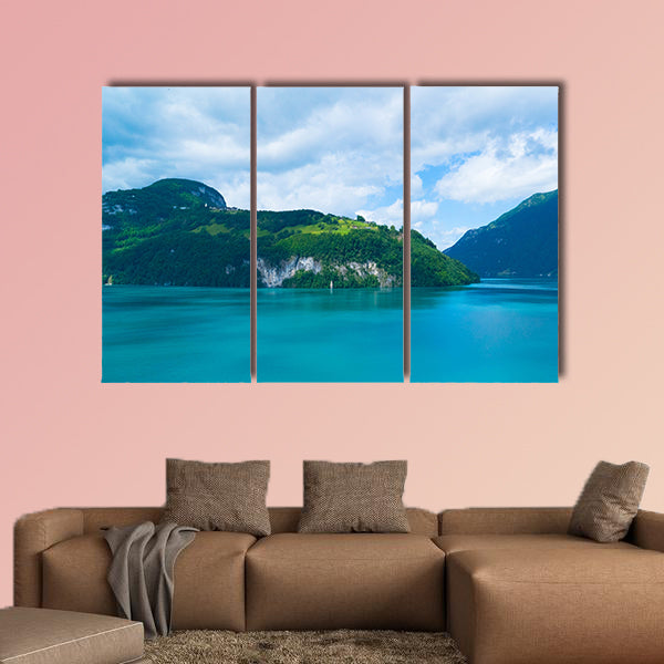 Blue lake and moving reflection of a sunny mountain backdrop wall art