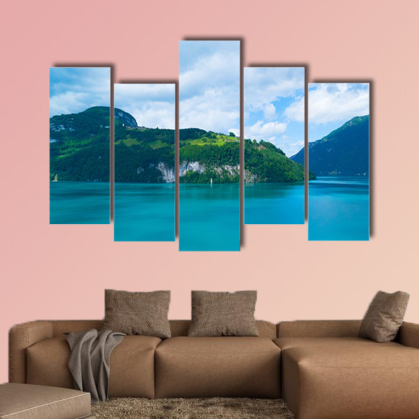 Blue lake and moving reflection of a sunny mountain backdrop wall art