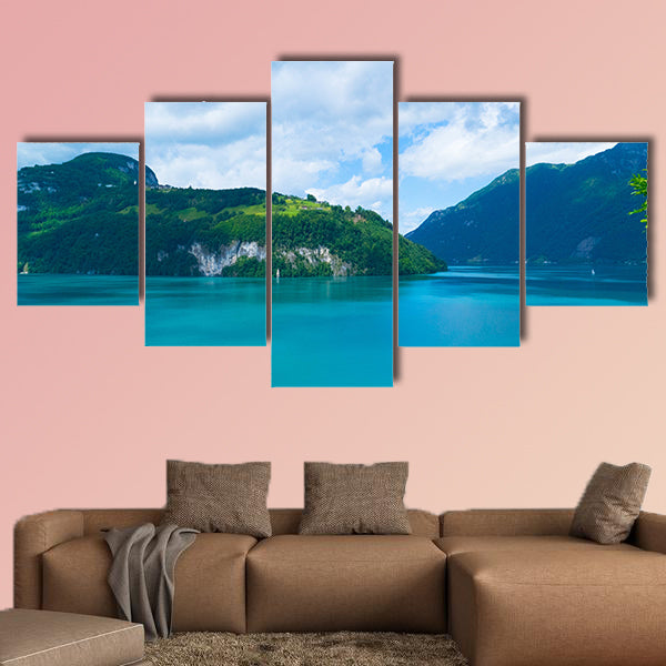 Blue lake and moving reflection of a sunny mountain backdrop wall art