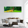 The figure of a bird's fire made of flowers Panoramic canvas Wall Art