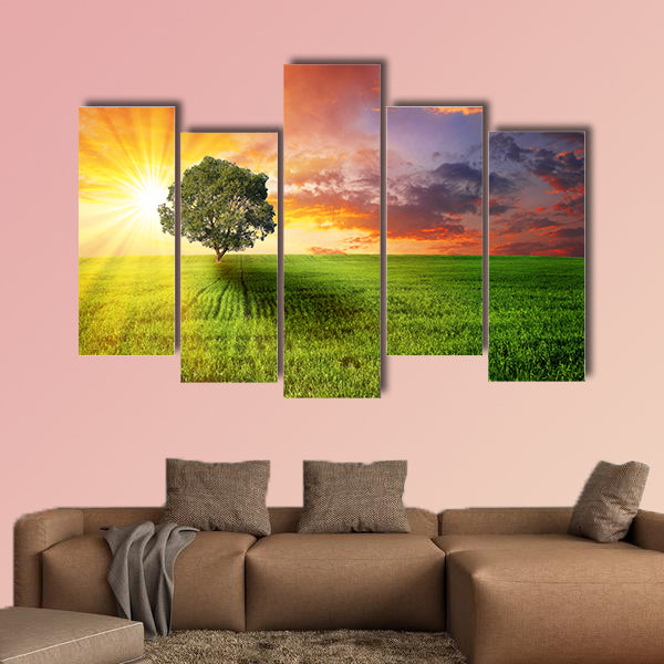 Alone tree on the green meadow at sunset multi panel canvas wall art