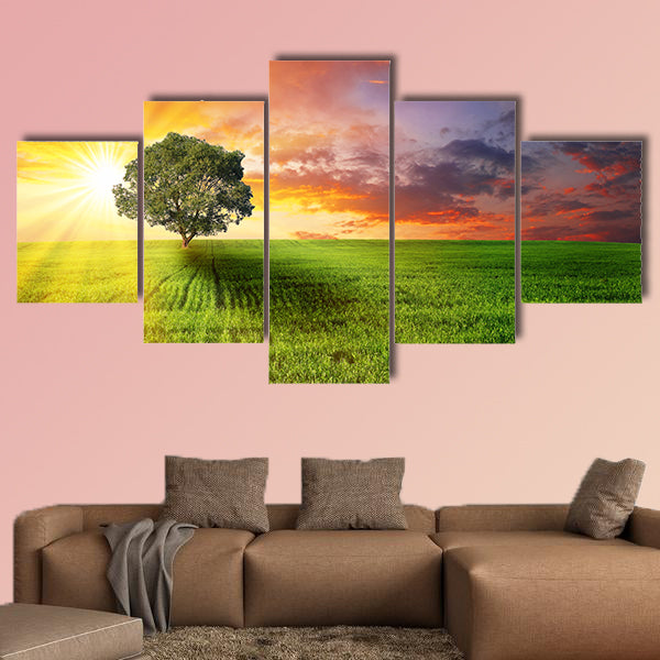 Alone tree on the green meadow at sunset multi panel canvas wall art