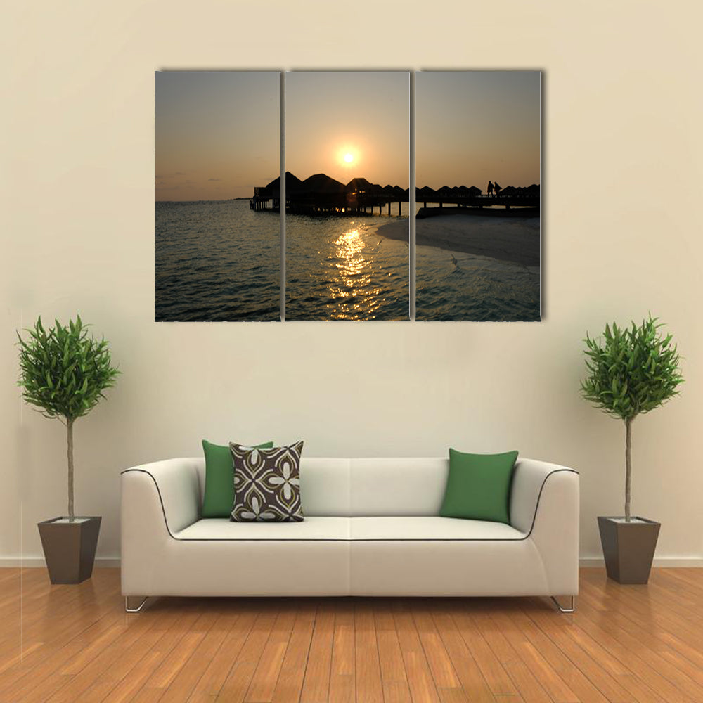 The Romance Of ACouple That EnjoyAn Idyllic Sunset stroll Multi Panel Canvas Wall Art