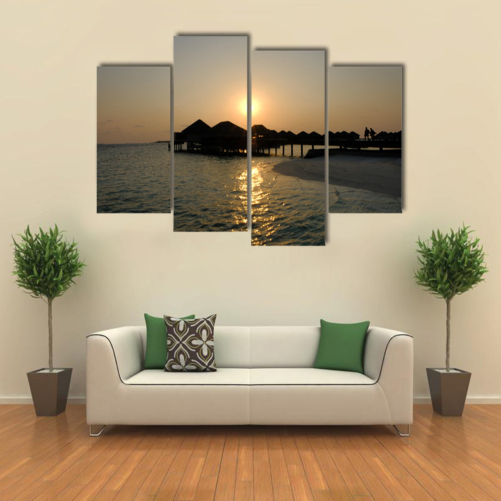 The Romance Of ACouple That EnjoyAn Idyllic Sunset stroll Multi Panel Canvas Wall Art