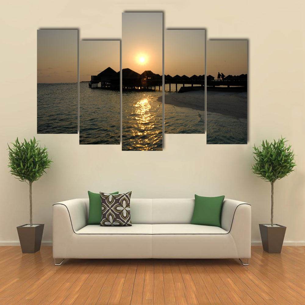 The Romance Of ACouple That EnjoyAn Idyllic Sunset stroll Multi Panel Canvas Wall Art