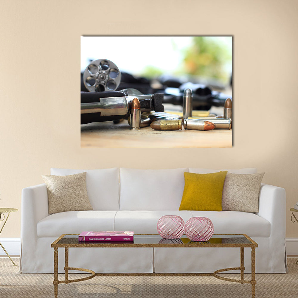 pistol and bullet on table wooden multi panel canvas wall art