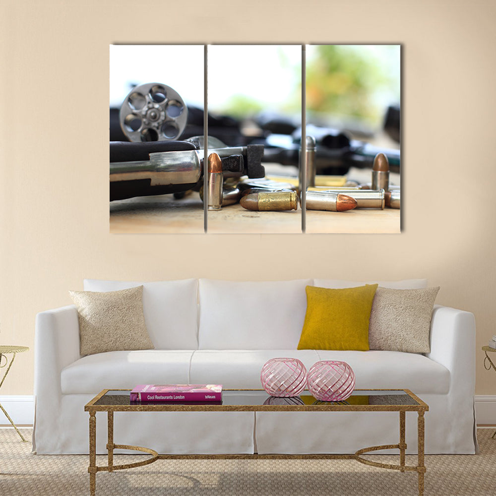 pistol and bullet on table wooden multi panel canvas wall art