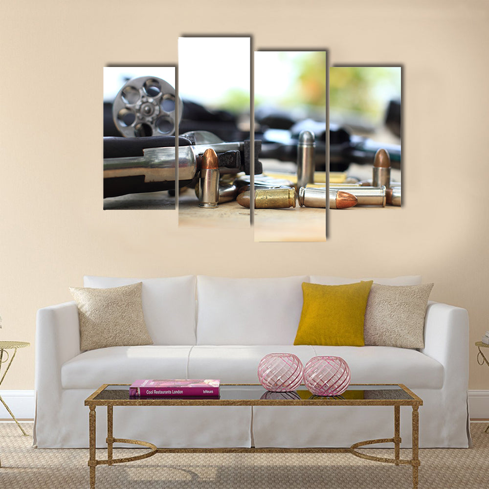 pistol and bullet on table wooden multi panel canvas wall art