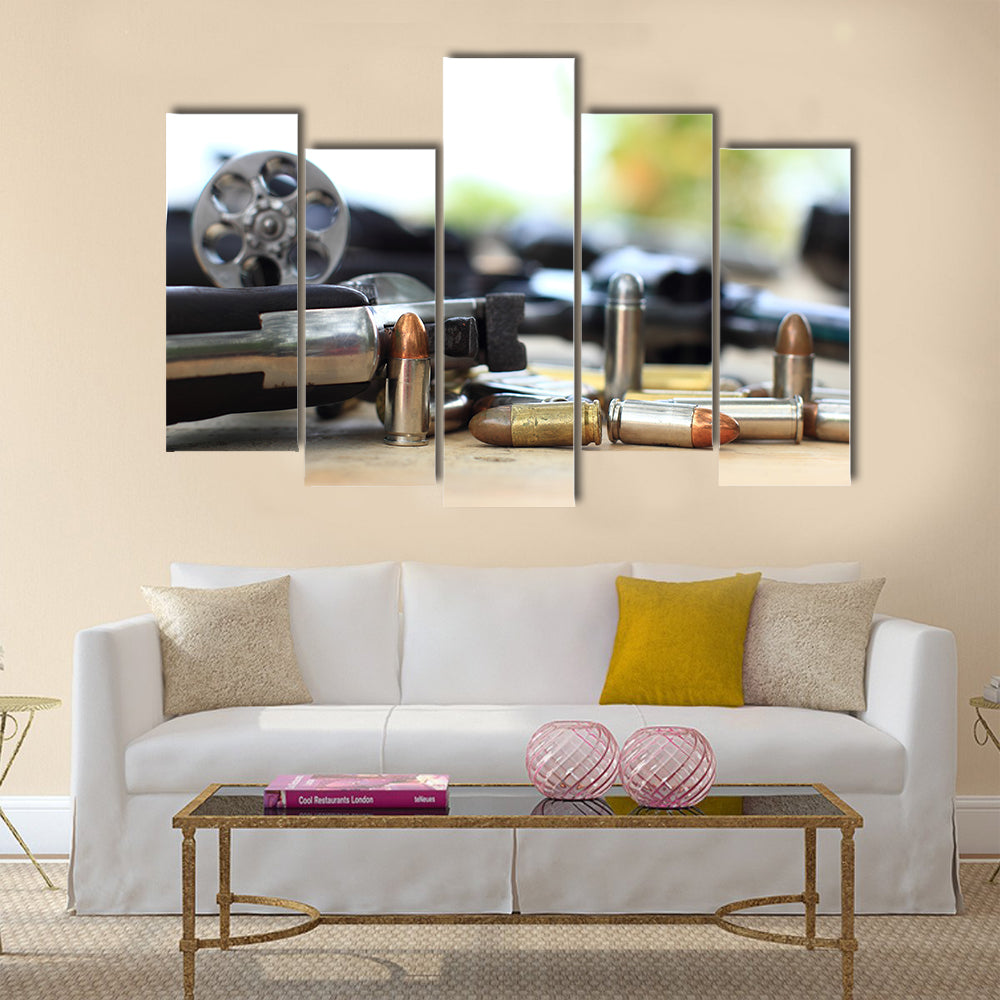 pistol and bullet on table wooden multi panel canvas wall art