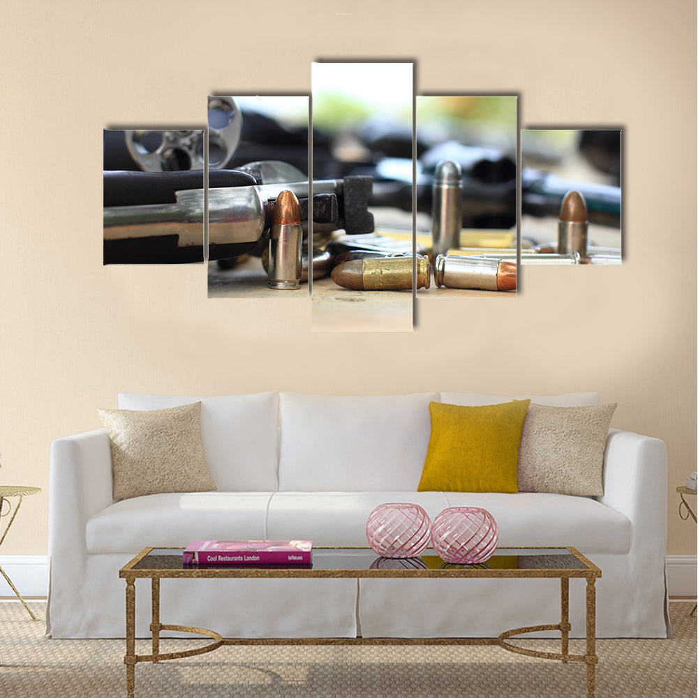 pistol and bullet on table wooden multi panel canvas wall art