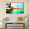 Old boat on the green sea with blue sky Multi Panel Canvas Wall Art