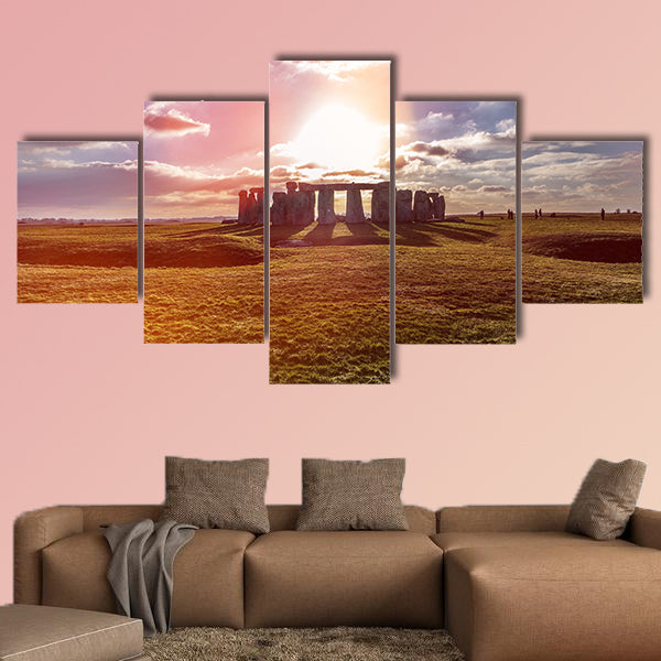 Stonehenge against the sun, Wiltshire, England Multi panel canvas wall art