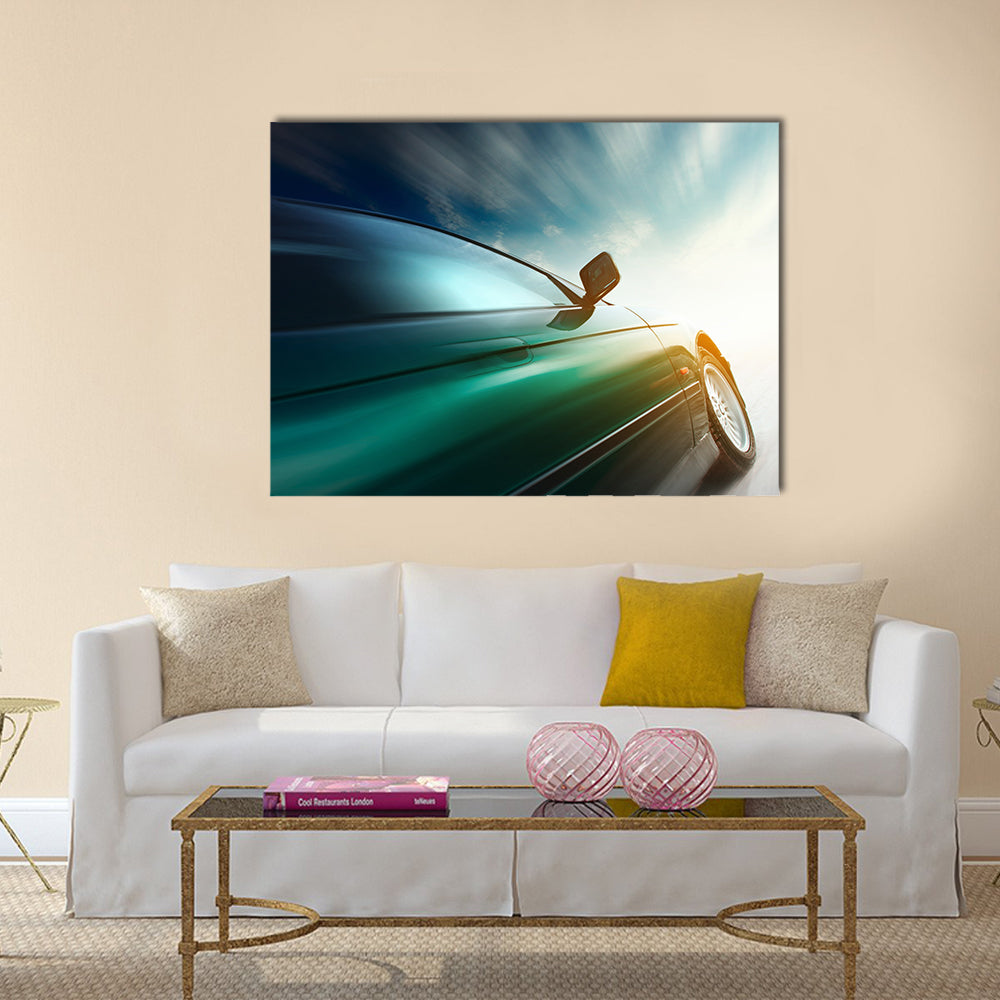Blurred car on road and sky with clouds Multi panel canvas wall art