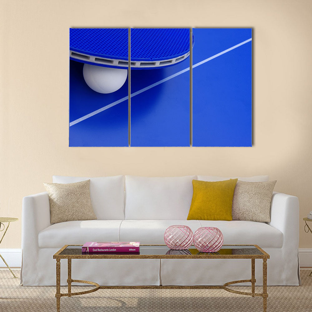 Image of a ping-pong ball with a racket on a table.multi panel canvas wall art