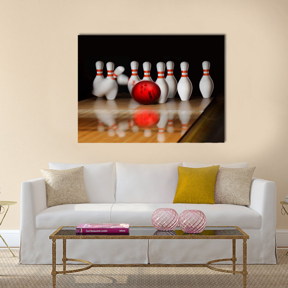 Orange ball does strike on tenpin bowling in skittle-ground Multi panel canvas wall art