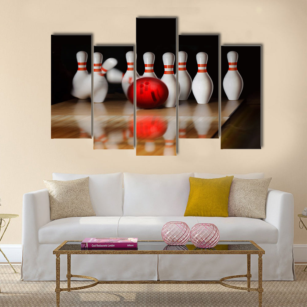 Orange ball does strike on tenpin bowling in skittle-ground Multi panel canvas wall art