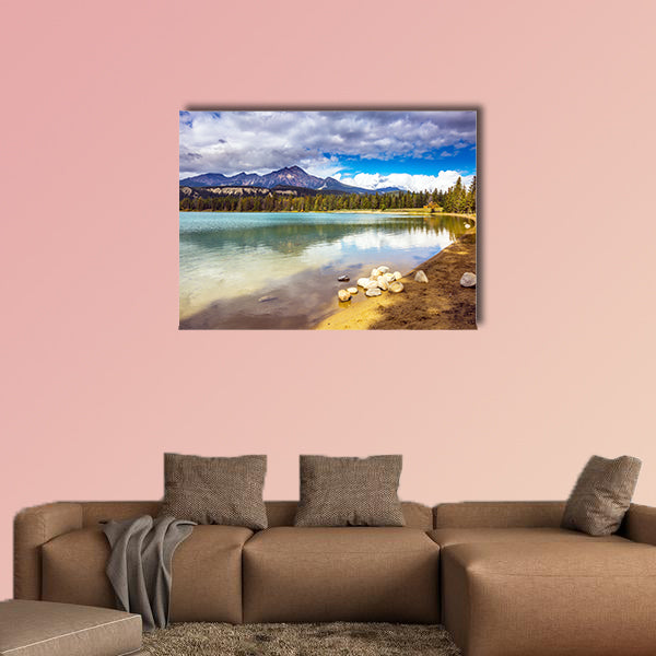 Pretty round lake in the coniferous forest. Canadian Rocky Mountains wall art
