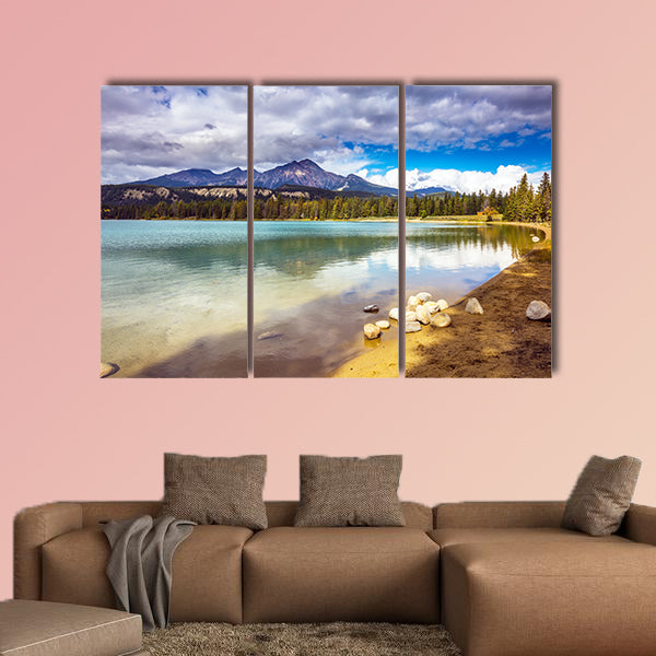 Pretty round lake in the coniferous forest. Canadian Rocky Mountains wall art