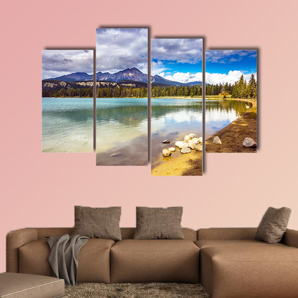 Pretty round lake in the coniferous forest. Canadian Rocky Mountains wall art