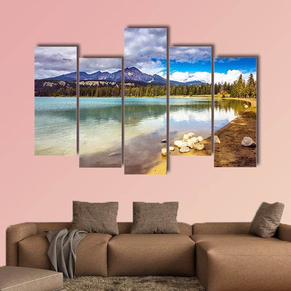Pretty round lake in the coniferous forest. Canadian Rocky Mountains wall art