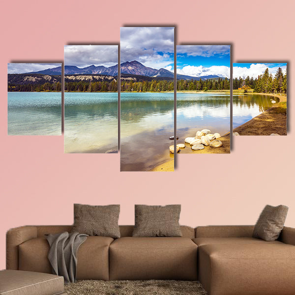 Pretty round lake in the coniferous forest. Canadian Rocky Mountains wall art