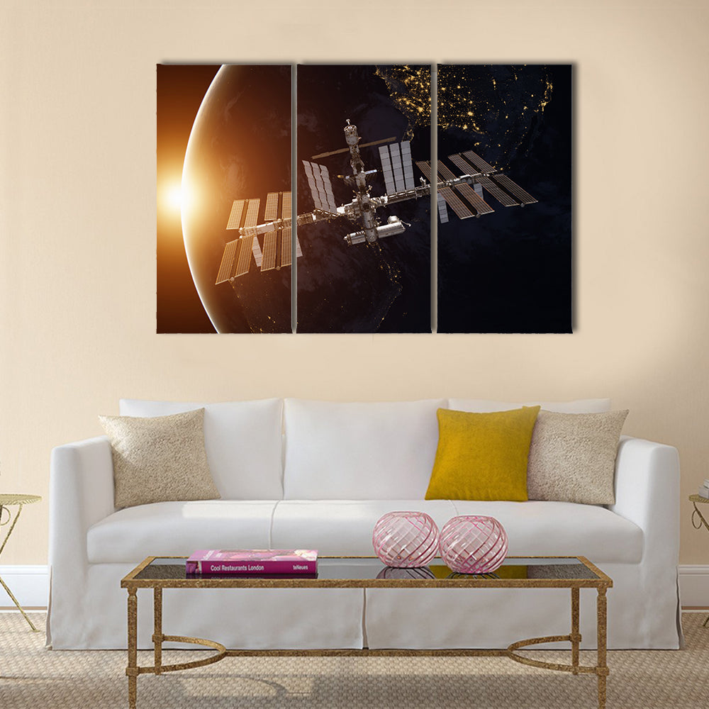 International Space Station over the planet Earth Multi Panel Canvas Wall Art