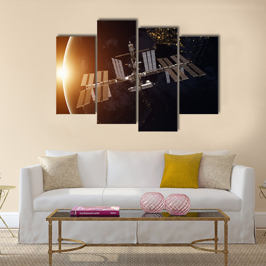 International Space Station over the planet Earth Multi Panel Canvas Wall Art