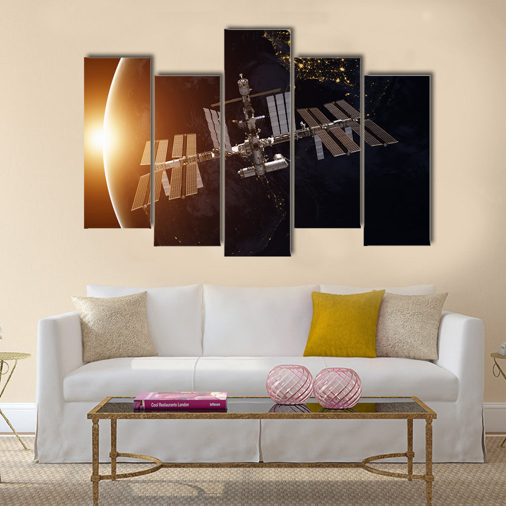 International Space Station over the planet Earth Multi Panel Canvas Wall Art