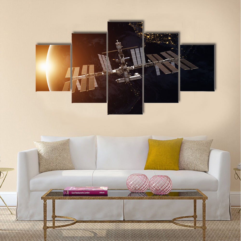 International Space Station over the planet Earth Multi Panel Canvas Wall Art