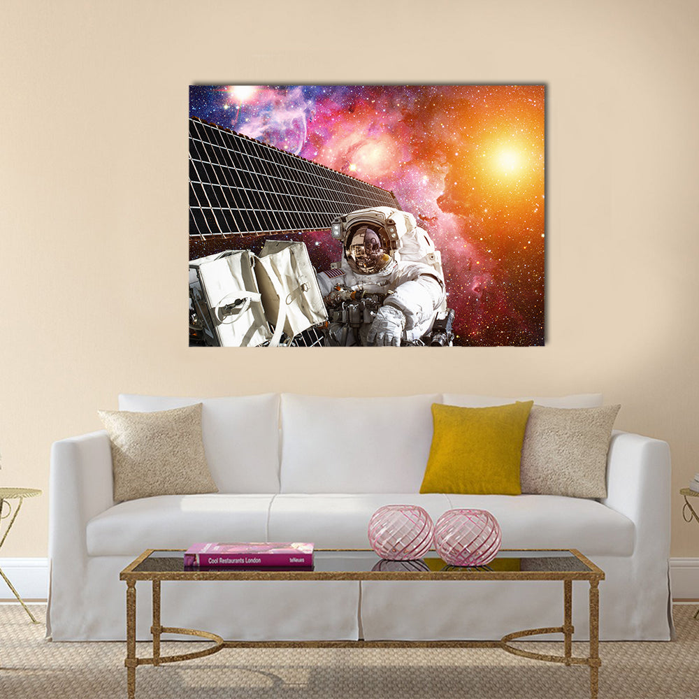 International Space Station and astronaut in outer space over the planet Earth Multi Panel Canvas Wall Art