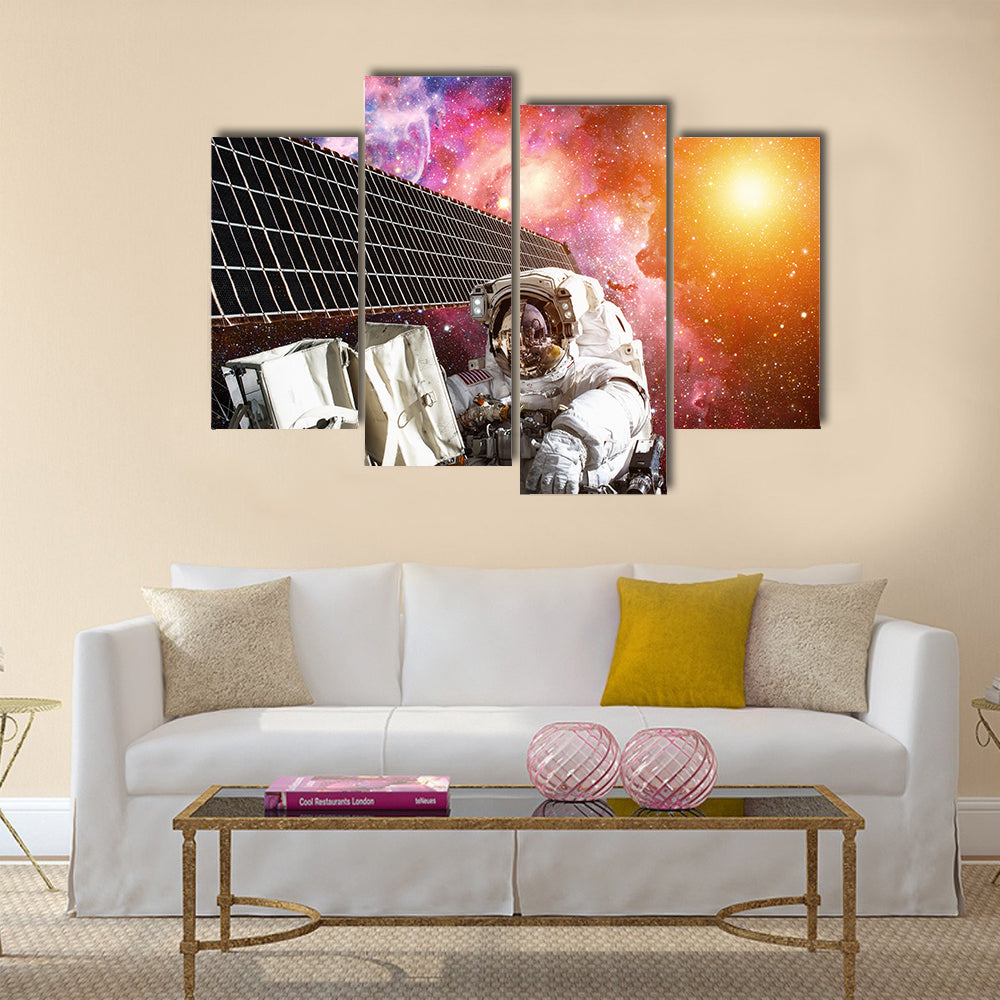 International Space Station and astronaut in outer space over the planet Earth Multi Panel Canvas Wall Art