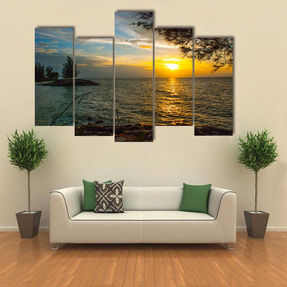 Beautiful Landscape view of the water, sky and clouds during sunset in city Bintulu multi panel canvas wall art