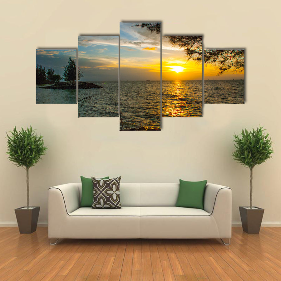 Beautiful Landscape view of the water, sky and clouds during sunset in city Bintulu multi panel canvas wall art