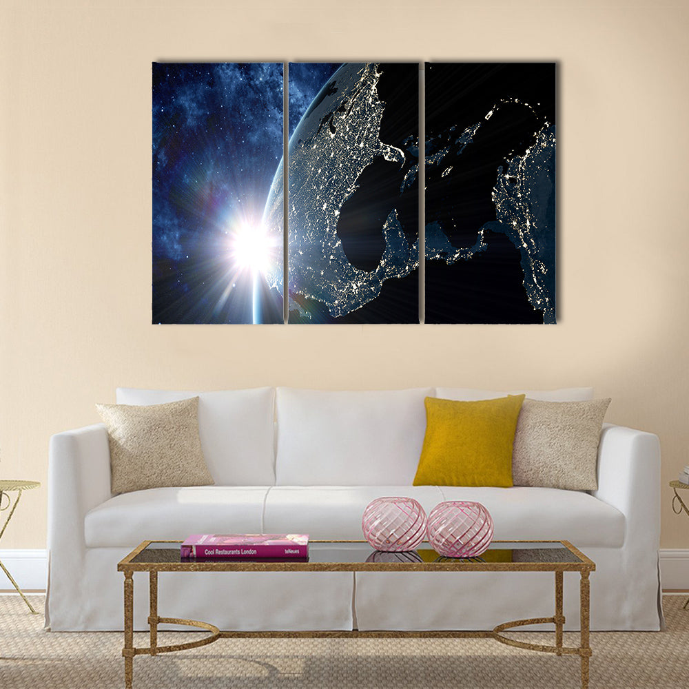 View on the night Earth with city lights glowing on the dark side Multi Panel Canvas Wall Art