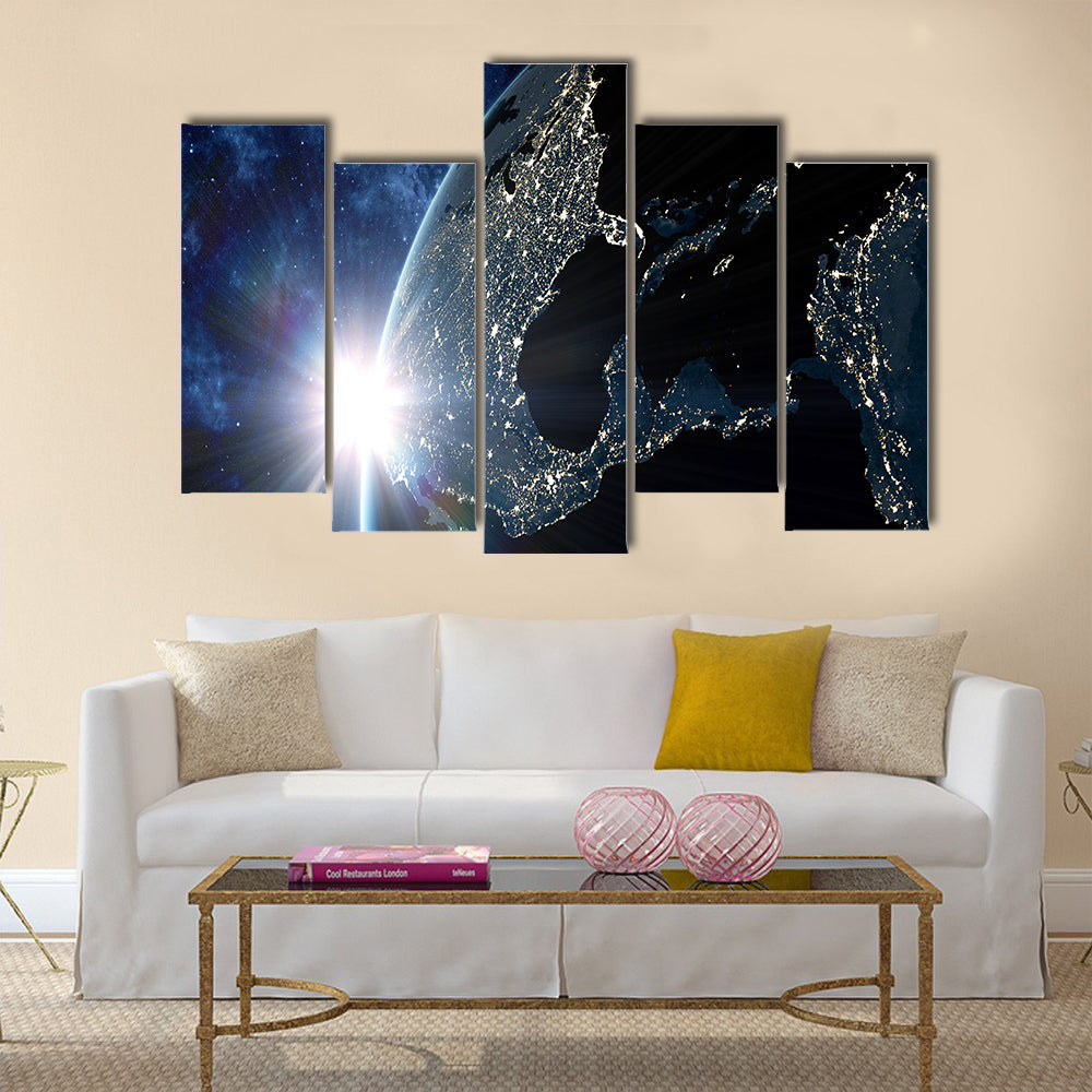 View on the night Earth with city lights glowing on the dark side Multi Panel Canvas Wall Art