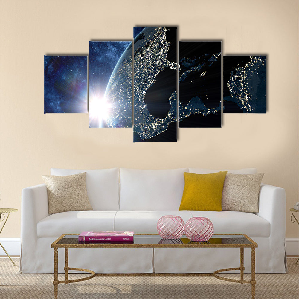 View on the night Earth with city lights glowing on the dark side Multi Panel Canvas Wall Art