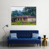 Almost destroyed houses in jungle of Cameroon where people live Multi panel canvas wall art