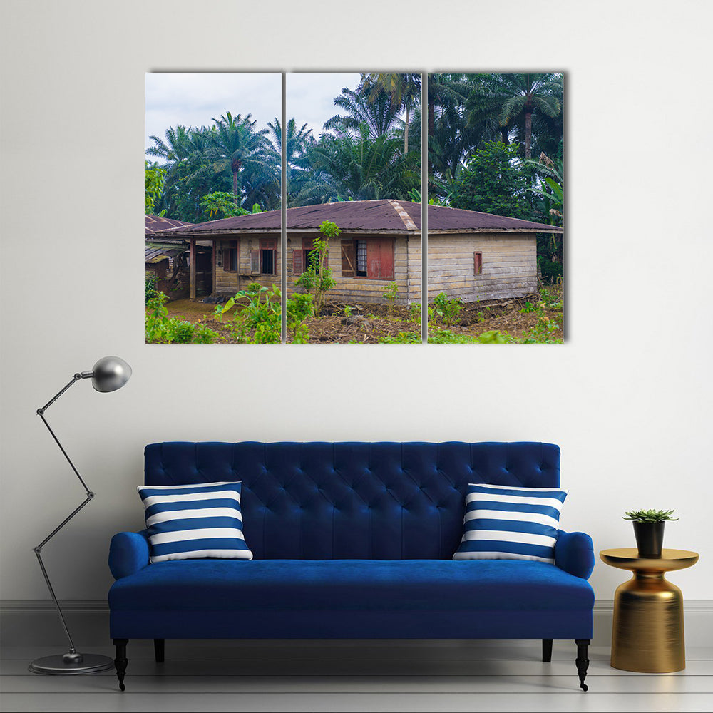Almost destroyed houses in jungle of Cameroon where people live Multi panel canvas wall art