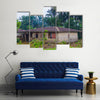 Almost destroyed houses in jungle of Cameroon where people live Multi panel canvas wall art